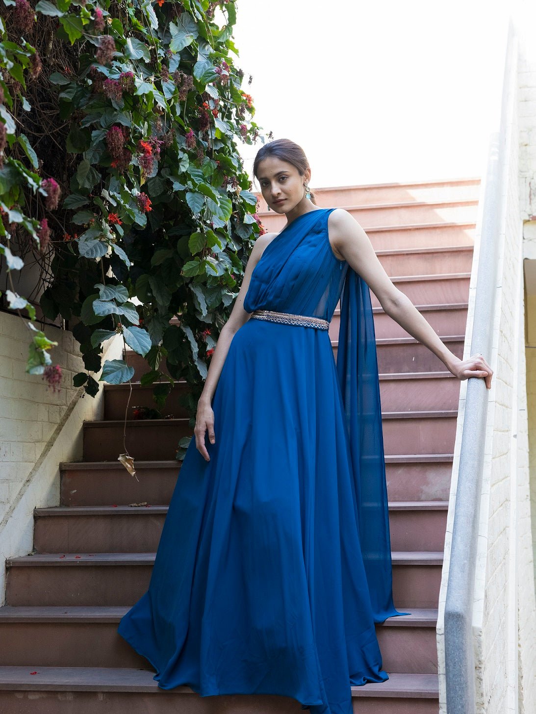 Shop stunning prussian blue gown online in USA with embellished belt. Dazzle on weddings and special occasions with exquisite Indian designer dresses, sharara suits, Anarkali suits, wedding lehengas from Pure Elegance Indian fashion store in USA.-front