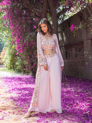 Shop stunning powder pink embroidered crop top with palazzo online in USA and jacket. Dazzle on weddings and special occasions with exquisite Indian designer dresses, sharara suits, Anarkali suits, wedding lehengas from Pure Elegance Indian fashion store in USA.-jacket
