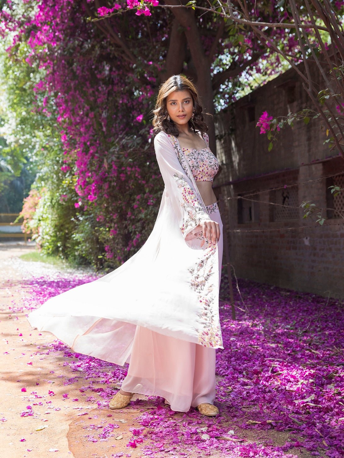 Shop stunning powder pink embroidered crop top with palazzo online in USA and jacket. Dazzle on weddings and special occasions with exquisite Indian designer dresses, sharara suits, Anarkali suits, wedding lehengas from Pure Elegance Indian fashion store in USA.-right