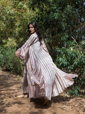 Shop stunning ivory printed maxi dress online in USA with cape jacket. Dazzle on weddings and special occasions with exquisite Indian designer dresses, sharara suits, Anarkali suits, wedding lehengas from Pure Elegance Indian fashion store in USA.-back
