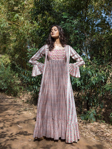Shop stunning ivory printed maxi dress online in USA with cape jacket. Dazzle on weddings and special occasions with exquisite Indian designer dresses, sharara suits, Anarkali suits, wedding lehengas from Pure Elegance Indian fashion store in USA.-full view