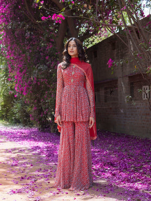 Buy gorgeous red drop print sharara suit online in USA with embellished front. Dazzle on weddings and special occasions with exquisite Indian designer dresses, sharara suits, Anarkali suits, wedding lehengas from Pure Elegance Indian fashion store in USA.-sharara