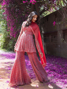 Buy gorgeous red drop print sharara suit online in USA with embellished front. Dazzle on weddings and special occasions with exquisite Indian designer dresses, sharara suits, Anarkali suits, wedding lehengas from Pure Elegance Indian fashion store in USA.-full view