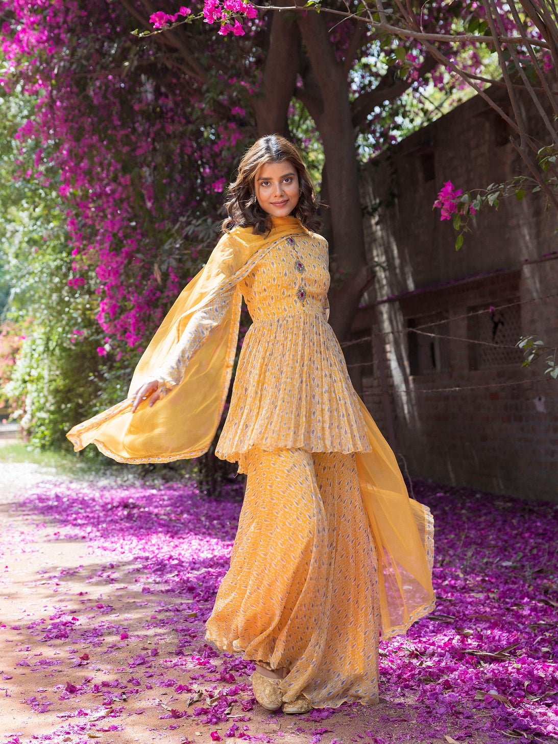 Shop beautiful yellow drop print sharara suit online in USA with embellished front. Dazzle on weddings and special occasions with exquisite Indian designer dresses, sharara suits, Anarkali suits, wedding lehengas from Pure Elegance Indian fashion store in USA.-full view