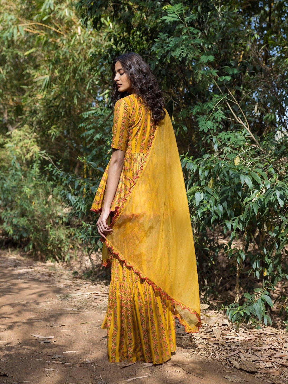 Buy beautiful mustard blossom print sharara suit online in USA. Dazzle on weddings and special occasions with exquisite Indian designer dresses, sharara suits, Anarkali suits, wedding lehengas from Pure Elegance Indian fashion store in USA.-back