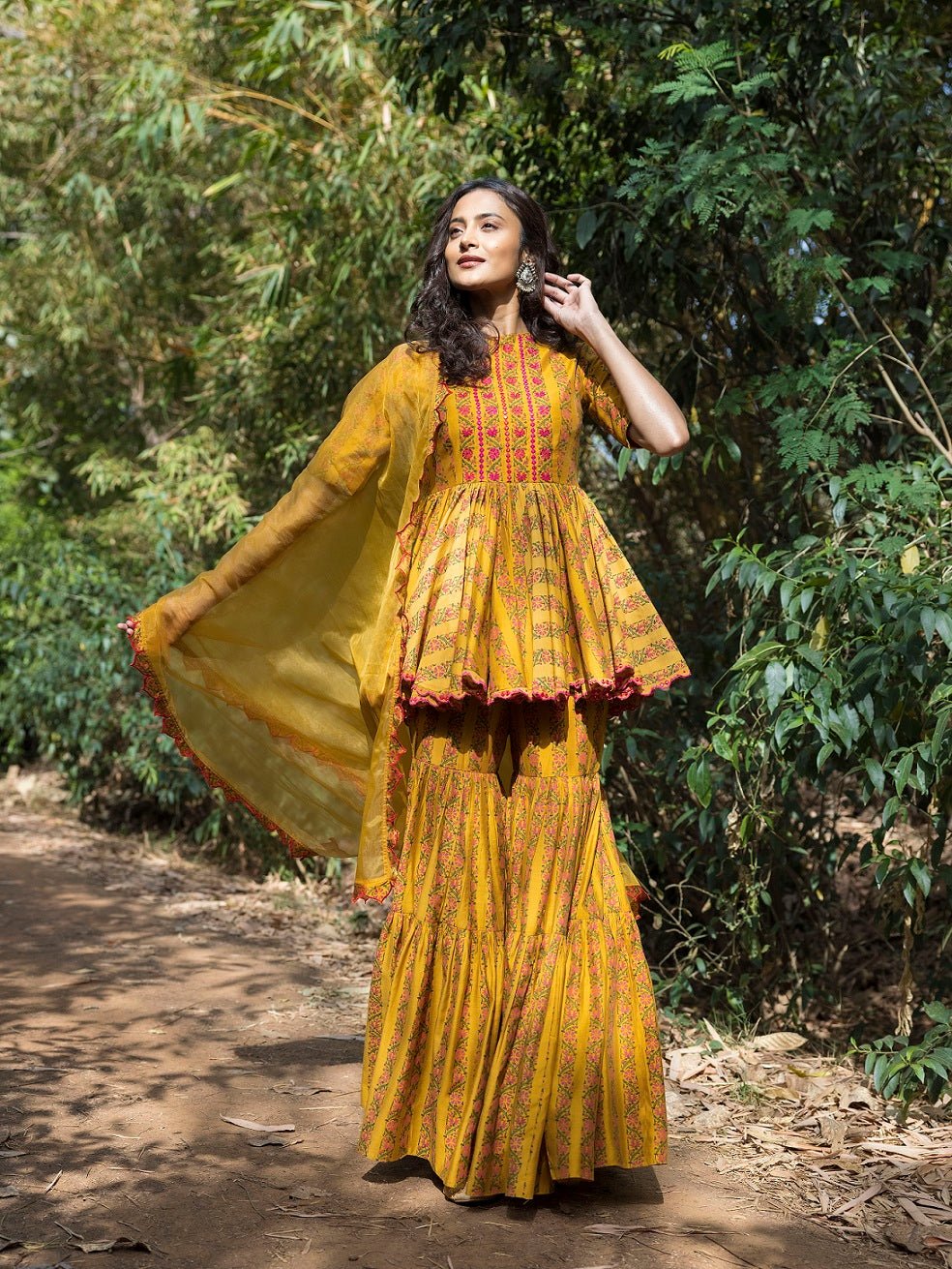 Buy beautiful mustard blossom print sharara suit online in USA. Dazzle on weddings and special occasions with exquisite Indian designer dresses, sharara suits, Anarkali suits, wedding lehengas from Pure Elegance Indian fashion store in USA.-full view
