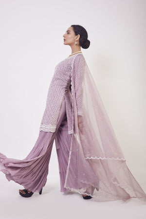 Shop lilac resham and cutdana work gharara suit in USA with dupatta. Dazzle on weddings and special occasions with exquisite Indian designer dresses, sharara suits, Anarkali suits, wedding lehengas from Pure Elegance Indian fashion store in USA.-gharara