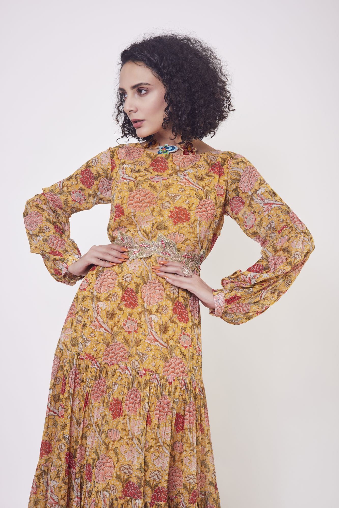 Buy stunning yellow floral print georgette tiered gown in USA. Dazzle on weddings and special occasions with exquisite Indian designer dresses, sharara suits, Anarkali suits, wedding lehengas from Pure Elegance Indian fashion store in USA.-closeup