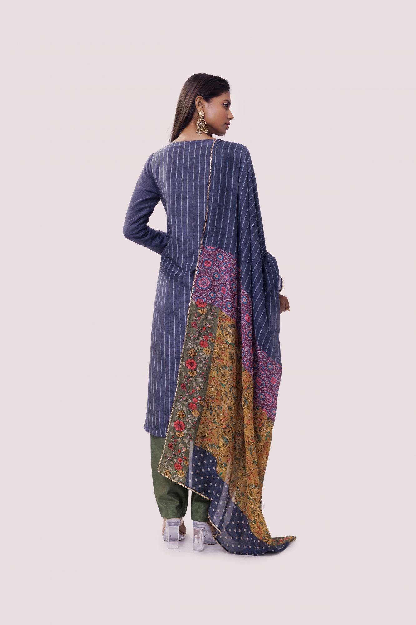 Shop blue striped chanderi suit in USA with green pants. Dazzle on weddings and special occasions with exquisite Indian designer dresses, sharara suits, Anarkali suits, wedding lehengas from Pure Elegance Indian fashion store in USA.-back