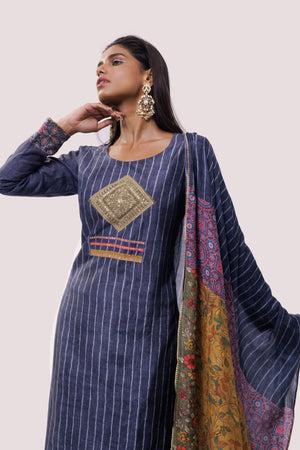 Shop blue striped chanderi suit in USA with green pants. Dazzle on weddings and special occasions with exquisite Indian designer dresses, sharara suits, Anarkali suits, wedding lehengas from Pure Elegance Indian fashion store in USA.-closeup