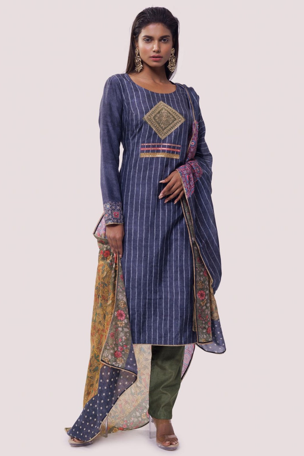 Shop blue striped chanderi suit in USA with green pants. Dazzle on weddings and special occasions with exquisite Indian designer dresses, sharara suits, Anarkali suits, wedding lehengas from Pure Elegance Indian fashion store in USA.-full view