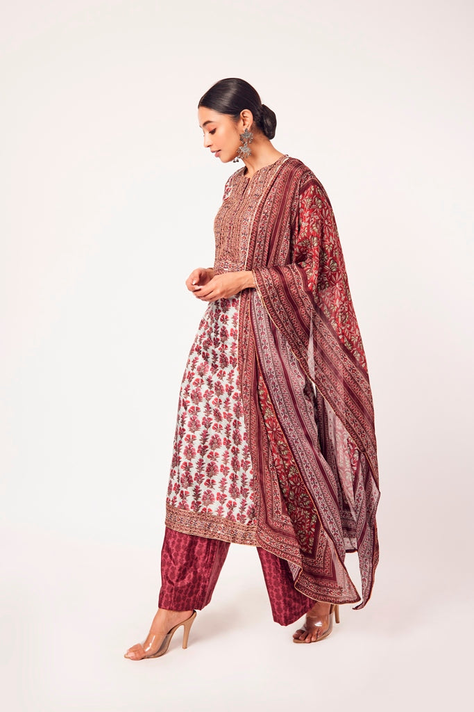 Buy powder blue and red printed crepe suit online in USA with dupatta. Dazzle on weddings and special occasions with exquisite Indian designer dresses, sharara suits, Anarkali suits, wedding lehengas from Pure Elegance Indian fashion store in USA.-side