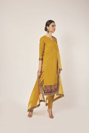 Shop beautiful mustard tikki and aari work georgette suit online in USA with dupatta. Dazzle on weddings and special occasions with exquisite Indian designer dresses, sharara suits, Anarkali suits, wedding lehengas from Pure Elegance Indian fashion store in USA.-side