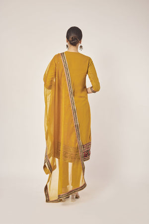 Shop beautiful mustard tikki and aari work georgette suit online in USA with dupatta. Dazzle on weddings and special occasions with exquisite Indian designer dresses, sharara suits, Anarkali suits, wedding lehengas from Pure Elegance Indian fashion store in USA.-back