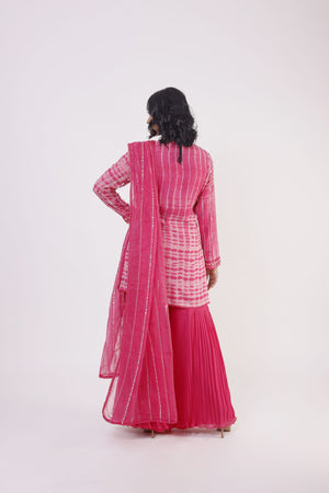 Buy pink mirror work georgette sharara suit online in USA with dupatta. Dazzle on weddings and special occasions with exquisite Indian designer dresses, sharara suits, Anarkali suits, wedding lehengas from Pure Elegance Indian fashion store in USA.-back