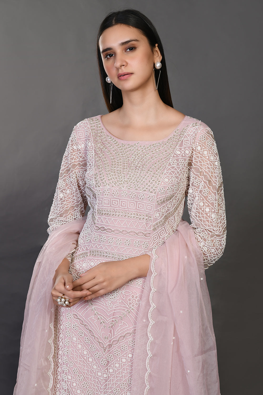 Shop powder pink embroidered organza sharara suit online in USA with dupatta. Dazzle on weddings and special occasions with exquisite Indian designer dresses, sharara suits, Anarkali suits, wedding lehengas from Pure Elegance Indian fashion store in USA.-closeup