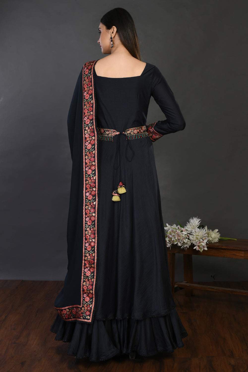 Shop black floorlength embroidered muslin Anarkali online in USA with dupatta. Dazzle on weddings and special occasions with exquisite Indian designer dresses, sharara suits, Anarkali suits, wedding lehengas from Pure Elegance Indian fashion store in USA.-back