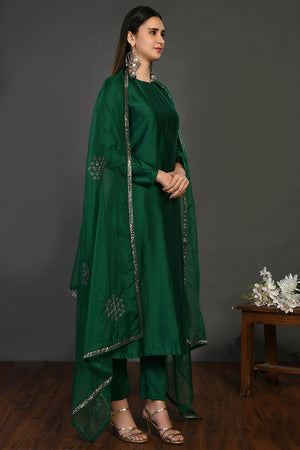 Buy bottle green cutdana work chanderi suit online in USA with dupatta. Dazzle on weddings and special occasions with exquisite Indian designer dresses, sharara suits, Anarkali suits, wedding lehengas from Pure Elegance Indian fashion store in USA.-right