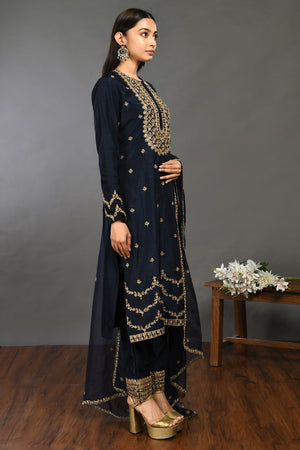 Buy prussian blue zardozi work Mysore silk suit online in USA with dupatta. Dazzle on weddings and special occasions with exquisite Indian designer dresses, sharara suits, Anarkali suits, wedding lehengas from Pure Elegance Indian fashion store in USA.-right