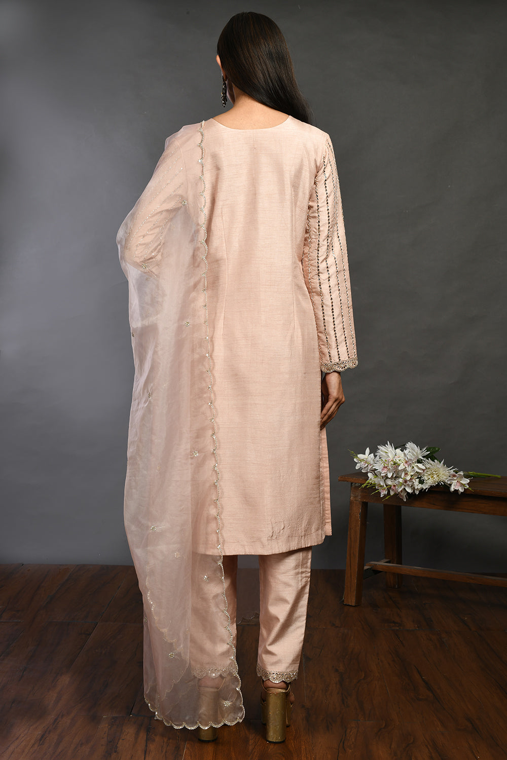 Buy beautiful powder pink mirror work silk suit online in USA with organza dupatta. Dazzle on weddings and special occasions with exquisite Indian designer dresses, sharara suits, Anarkali suits, wedding lehengas from Pure Elegance Indian fashion store in USA.-back
