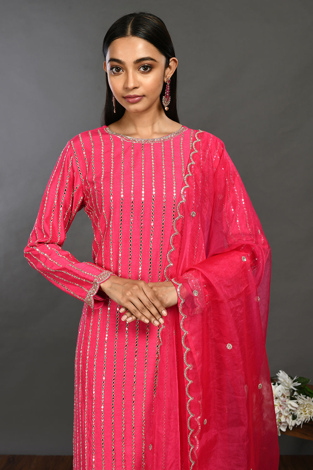 Shop rani pink mirror work silk suit online in USA with organza dupatta. Dazzle on weddings and special occasions with exquisite Indian designer dresses, sharara suits, Anarkali suits, wedding lehengas from Pure Elegance Indian fashion store in USA.-closeup