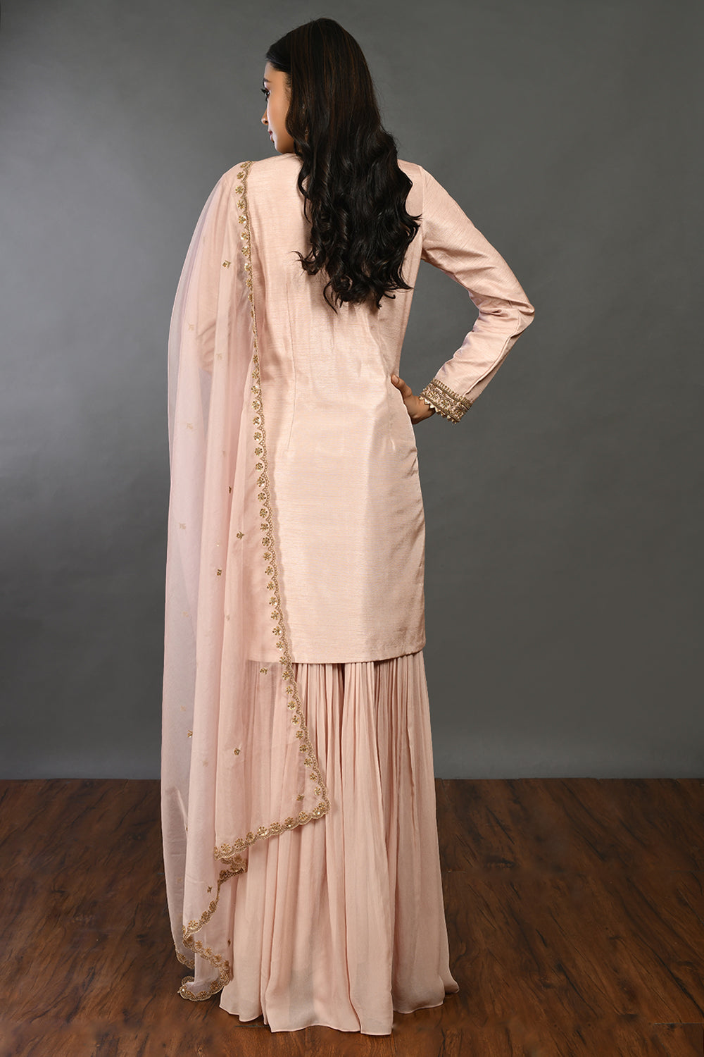Buy dusty pink zari and bulian work silk suit online in USA with organza dupatta. Dazzle on weddings and special occasions with exquisite Indian designer dresses, sharara suits, Anarkali suits, wedding lehengas from Pure Elegance Indian fashion store in USA.-back