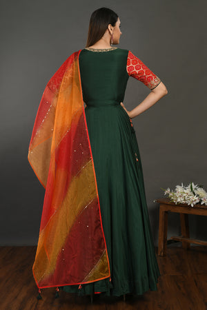 Buy beautiful bottle green muslin Anarkali suit online in USA with red orange dupatta. Dazzle on weddings and special occasions with exquisite Indian designer dresses, sharara suits, Anarkali suits, wedding lehengas from Pure Elegance Indian fashion store in USA.-back