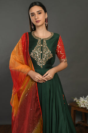 Buy beautiful bottle green muslin Anarkali suit online in USA with red orange dupatta. Dazzle on weddings and special occasions with exquisite Indian designer dresses, sharara suits, Anarkali suits, wedding lehengas from Pure Elegance Indian fashion store in USA.-closeup