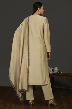 Shop beige embroidered chanderi cotton suit online in USA with dupatta. Dazzle on weddings and special occasions with exquisite Indian designer dresses, sharara suits, Anarkali suits, wedding lehengas from Pure Elegance Indian fashion store in USA.-back