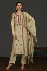 Shop beige embroidered chanderi cotton suit online in USA with dupatta. Dazzle on weddings and special occasions with exquisite Indian designer dresses, sharara suits, Anarkali suits, wedding lehengas from Pure Elegance Indian fashion store in USA.-full view