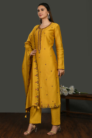 Shop mustard embroidered chanderi cotton suit online in USA with dupatta. Dazzle on weddings and special occasions with exquisite Indian designer dresses, sharara suits, Anarkali suits, wedding lehengas from Pure Elegance Indian fashion store in USA.-left