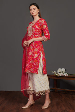 Buy red and white stone work bandhej palazzo suit online in USA with dupatta. Dazzle on weddings and special occasions with exquisite Indian designer dresses, sharara suits, Anarkali suits, wedding lehengas from Pure Elegance Indian fashion store in USA.-left