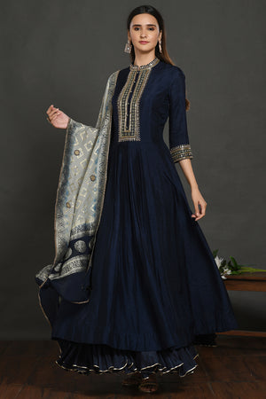 Shop navy blue embroidered Anarkali suit online in USA with grey dupatta. Dazzle on weddings and special occasions with exquisite Indian designer dresses, sharara suits, Anarkali suits, wedding lehengas from Pure Elegance Indian fashion store in USA.-front