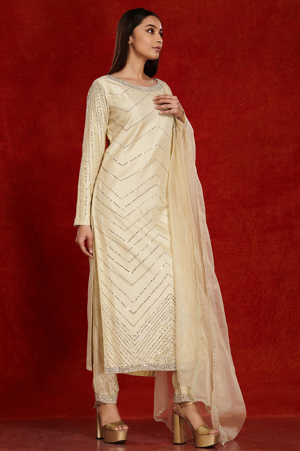 Shop stunning cream embroidered silk suit online in USA with pants. Dazzle on weddings and special occasions with exquisite Indian designer dresses, sharara suits, Anarkali suits, wedding lehengas from Pure Elegance Indian fashion store in USA.-side