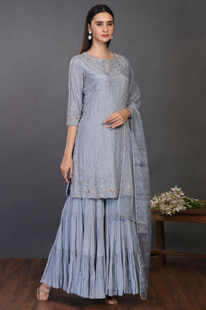 Buy stunning doctor blue embroidered silk sharara suit online in USA. Dazzle on weddings and special occasions with exquisite Indian designer dresses, sharara suits, Anarkali suits, wedding lehengas from Pure Elegance Indian fashion store in USA.-suit