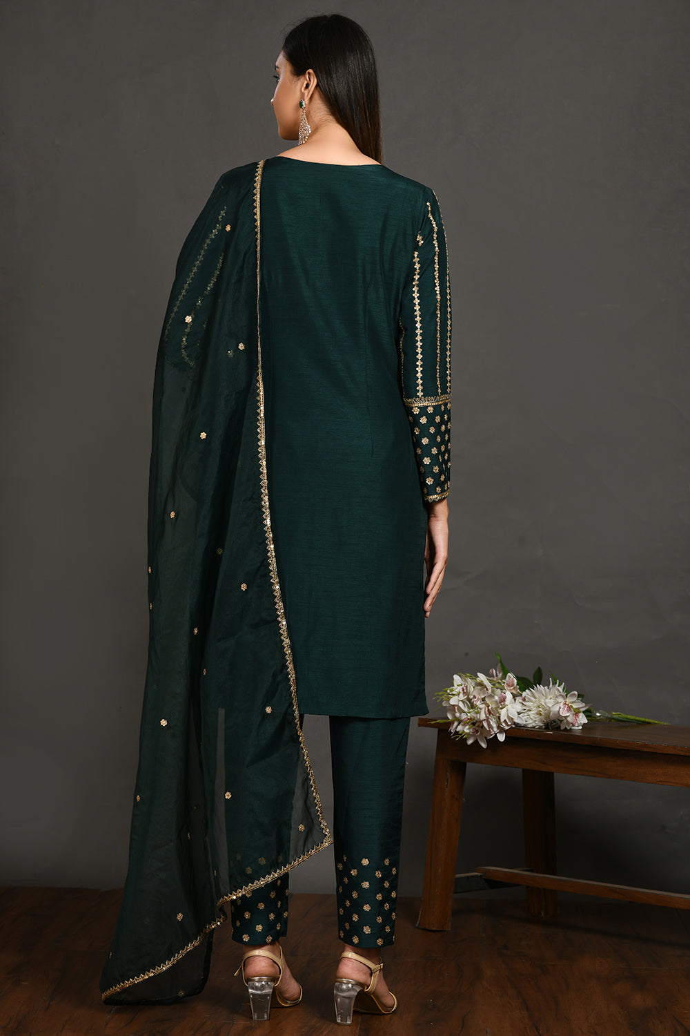 Shop stunning bottle green cutdana, sequin and zari work silk suit online in USA. Dazzle on weddings and special occasions with exquisite Indian designer dresses, sharara suits, Anarkali suits, wedding lehengas from Pure Elegance Indian fashion store in USA.-back