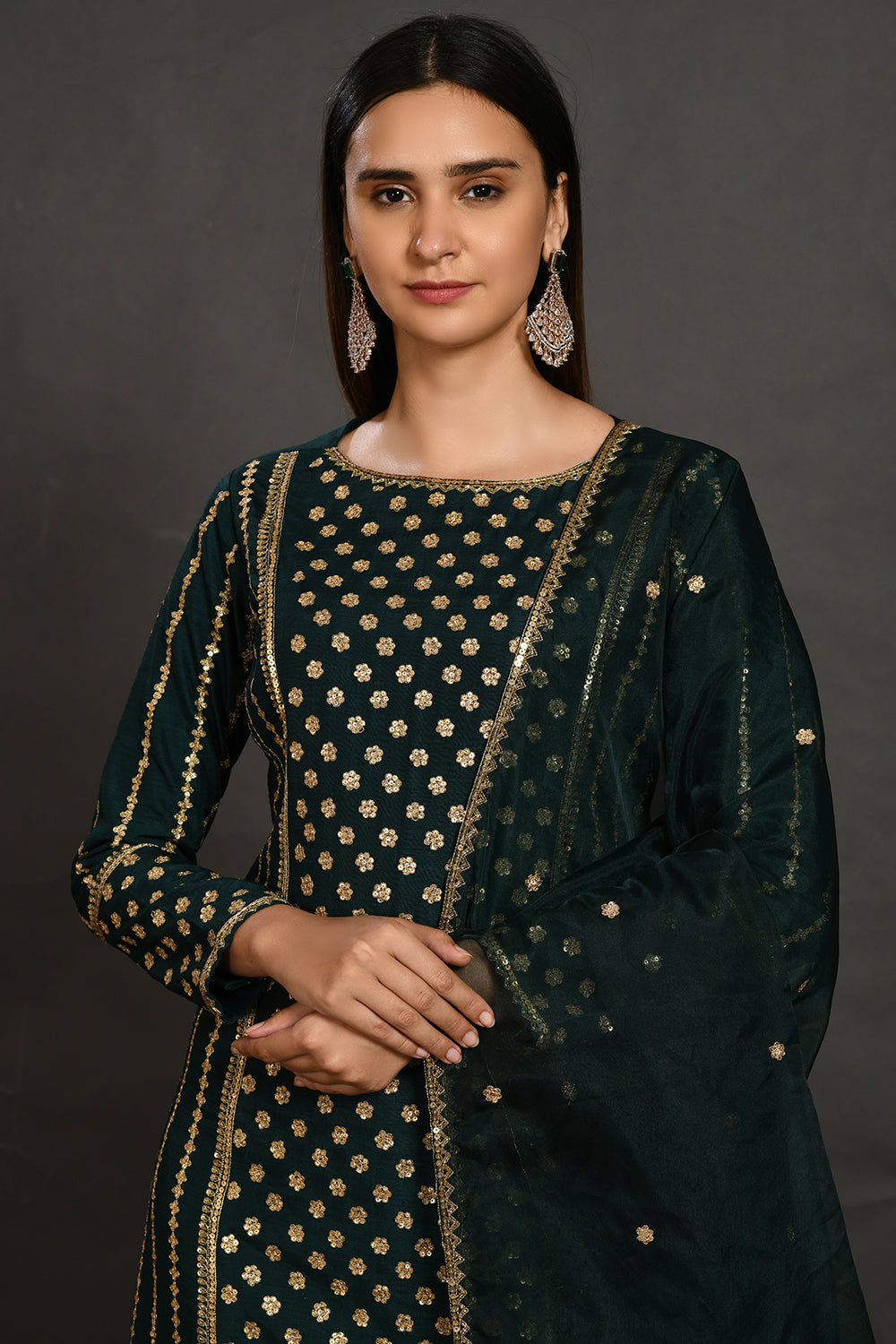 Shop stunning bottle green cutdana, sequin and zari work silk suit online in USA. Dazzle on weddings and special occasions with exquisite Indian designer dresses, sharara suits, Anarkali suits, wedding lehengas from Pure Elegance Indian fashion store in USA.-closeup