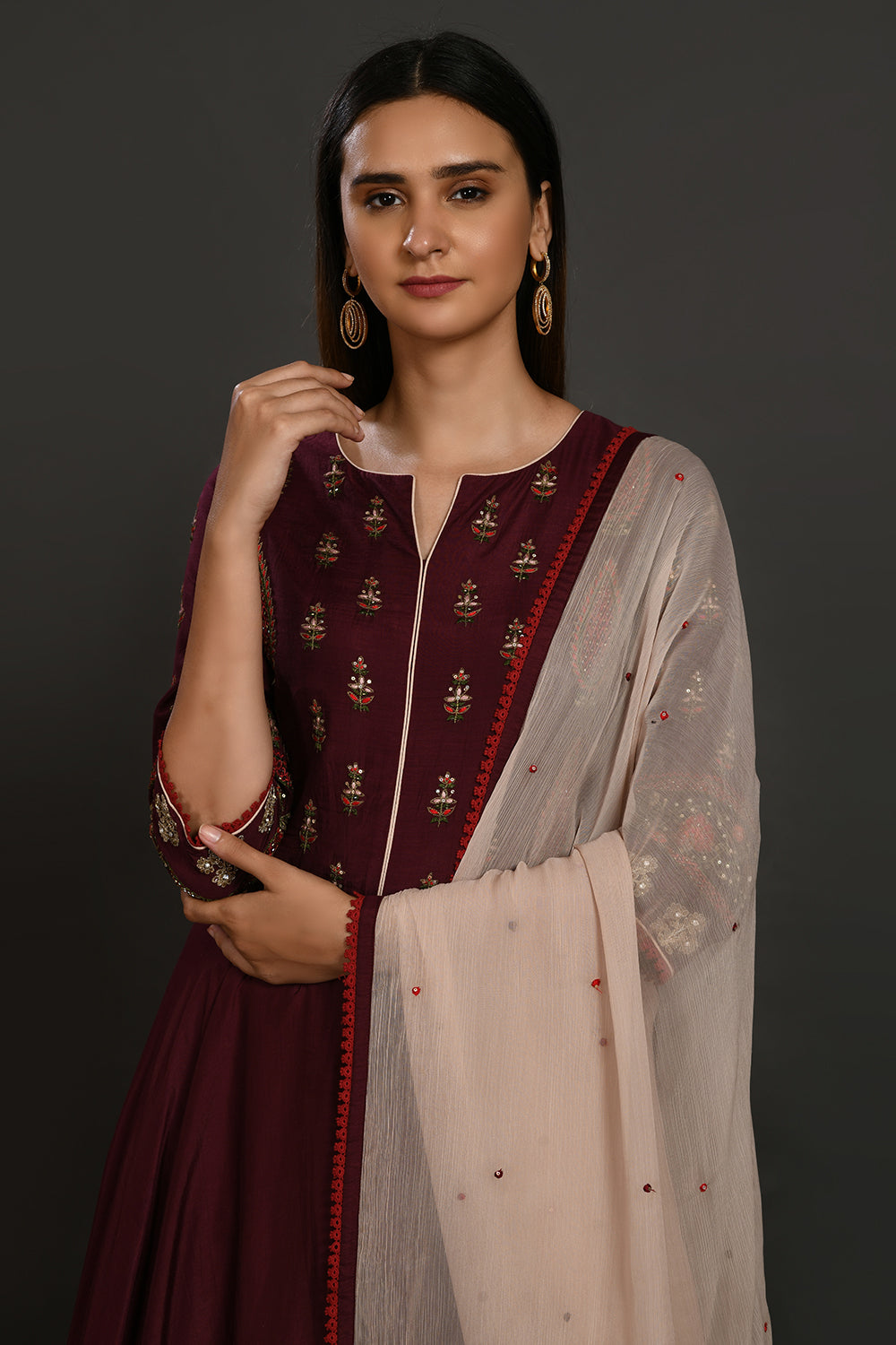 Buy wine embroidered muslin Anarkali suit online in USA with dupatta. Dazzle on weddings and special occasions with exquisite Indian designer dresses, sharara suits, Anarkali suits, wedding lehengas from Pure Elegance Indian fashion store in USA.-closeup