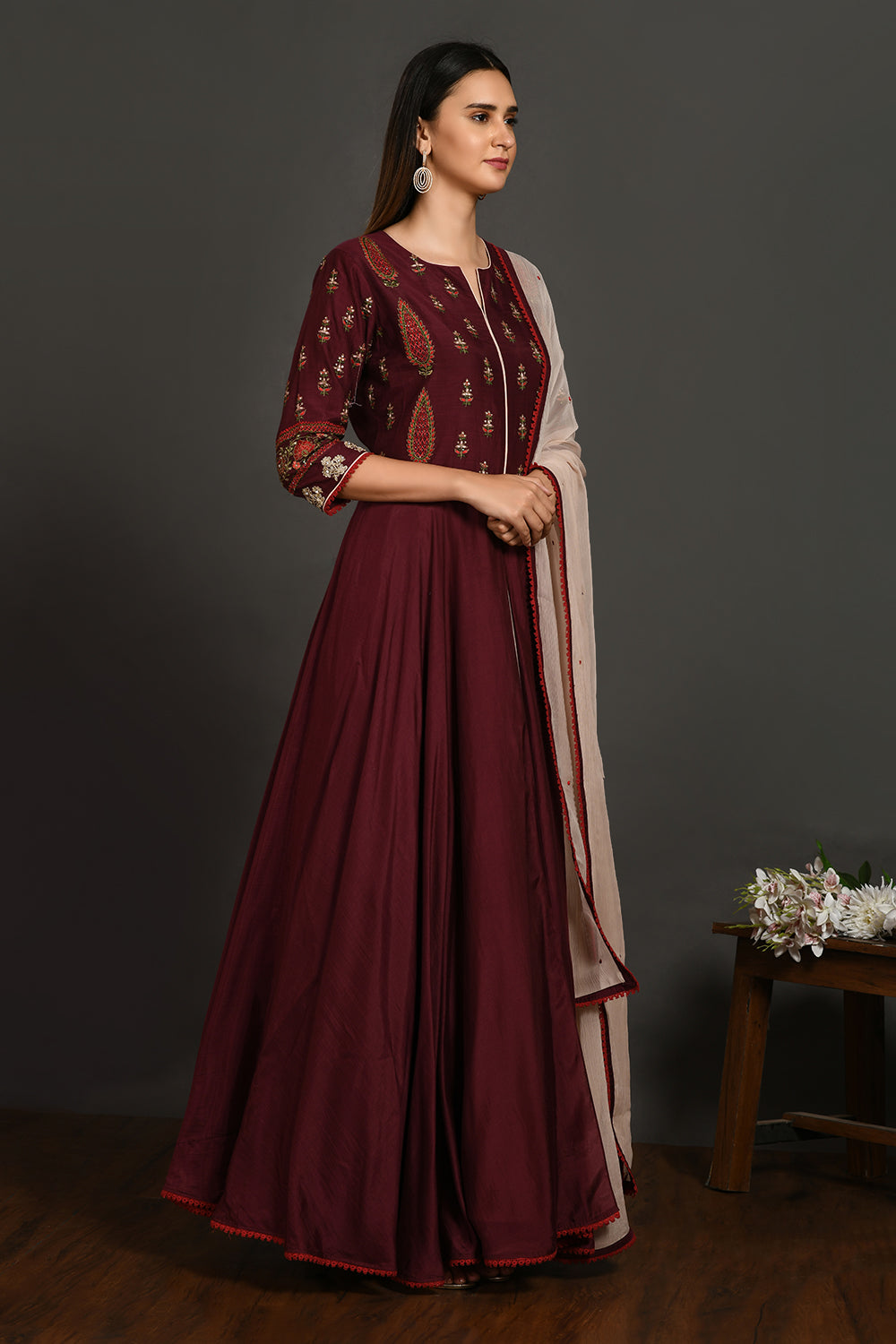 Buy wine embroidered muslin Anarkali suit online in USA with dupatta. Dazzle on weddings and special occasions with exquisite Indian designer dresses, sharara suits, Anarkali suits, wedding lehengas from Pure Elegance Indian fashion store in USA.-side