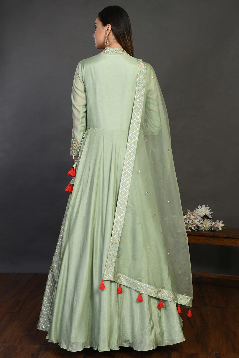 Buy pista green muslin Anarkali suit online in USA with dupatta. Dazzle on weddings and special occasions with exquisite Indian designer dresses, sharara suits, Anarkali suits, wedding lehengas from Pure Elegance Indian fashion store in USA.-back