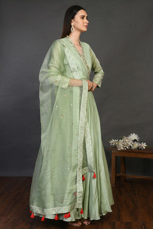 Buy pista green muslin Anarkali suit online in USA with dupatta. Dazzle on weddings and special occasions with exquisite Indian designer dresses, sharara suits, Anarkali suits, wedding lehengas from Pure Elegance Indian fashion store in USA.-side
