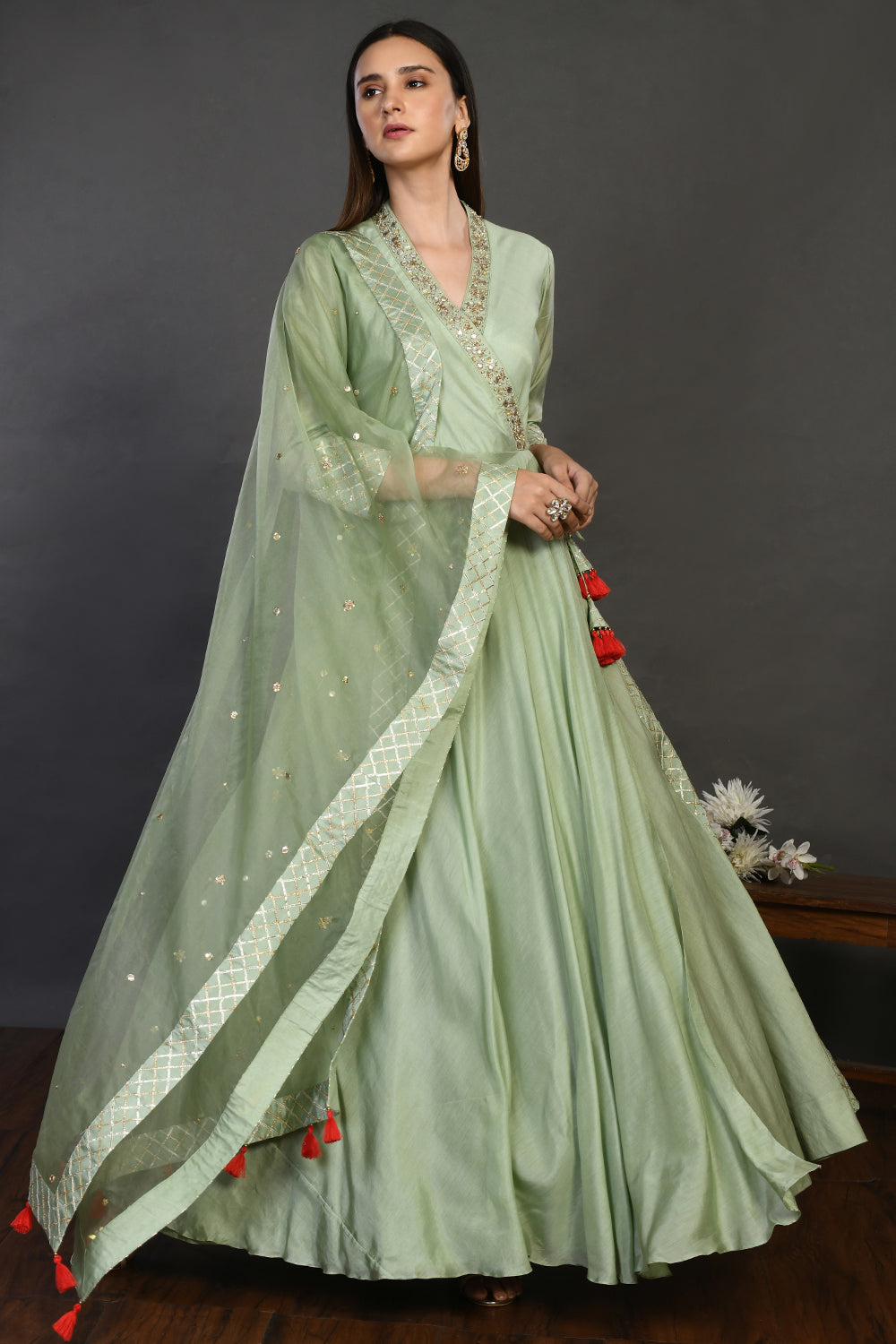 Buy pista green muslin Anarkali suit online in USA with dupatta. Dazzle on weddings and special occasions with exquisite Indian designer dresses, sharara suits, Anarkali suits, wedding lehengas from Pure Elegance Indian fashion store in USA.-front