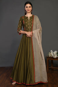 Shop green stone work Anarkali suit online in USA with beige dupatta. Dazzle on weddings and special occasions with exquisite Indian designer dresses, sharara suits, Anarkali suits, wedding lehengas from Pure Elegance Indian fashion store in USA.-full view