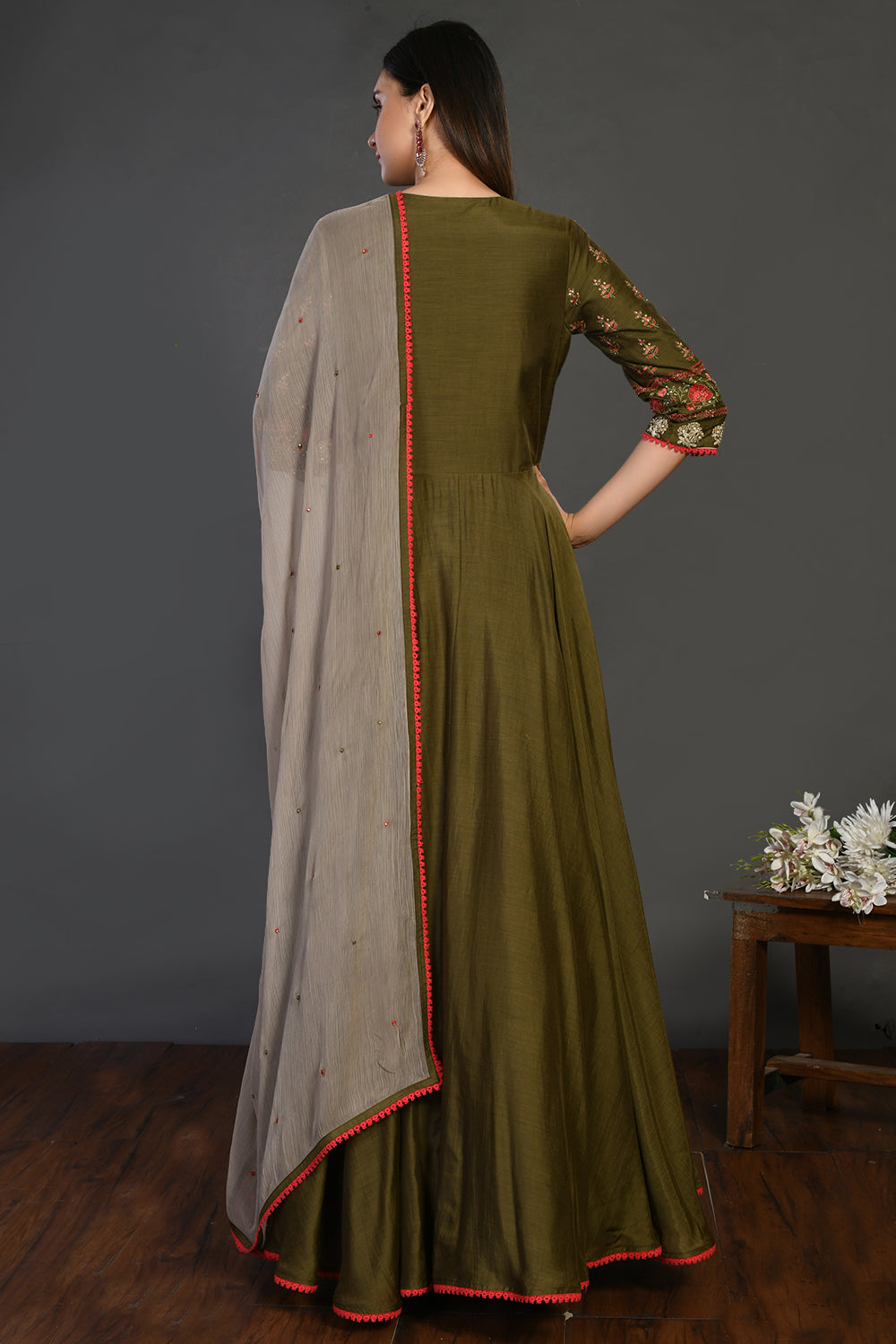 Shop green stone work Anarkali suit online in USA with beige dupatta. Dazzle on weddings and special occasions with exquisite Indian designer dresses, sharara suits, Anarkali suits, wedding lehengas from Pure Elegance Indian fashion store in USA.-back
