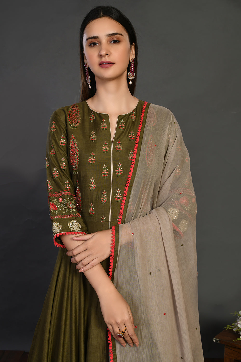 Shop green stone work Anarkali suit online in USA with beige dupatta. Dazzle on weddings and special occasions with exquisite Indian designer dresses, sharara suits, Anarkali suits, wedding lehengas from Pure Elegance Indian fashion store in USA.-closeup
