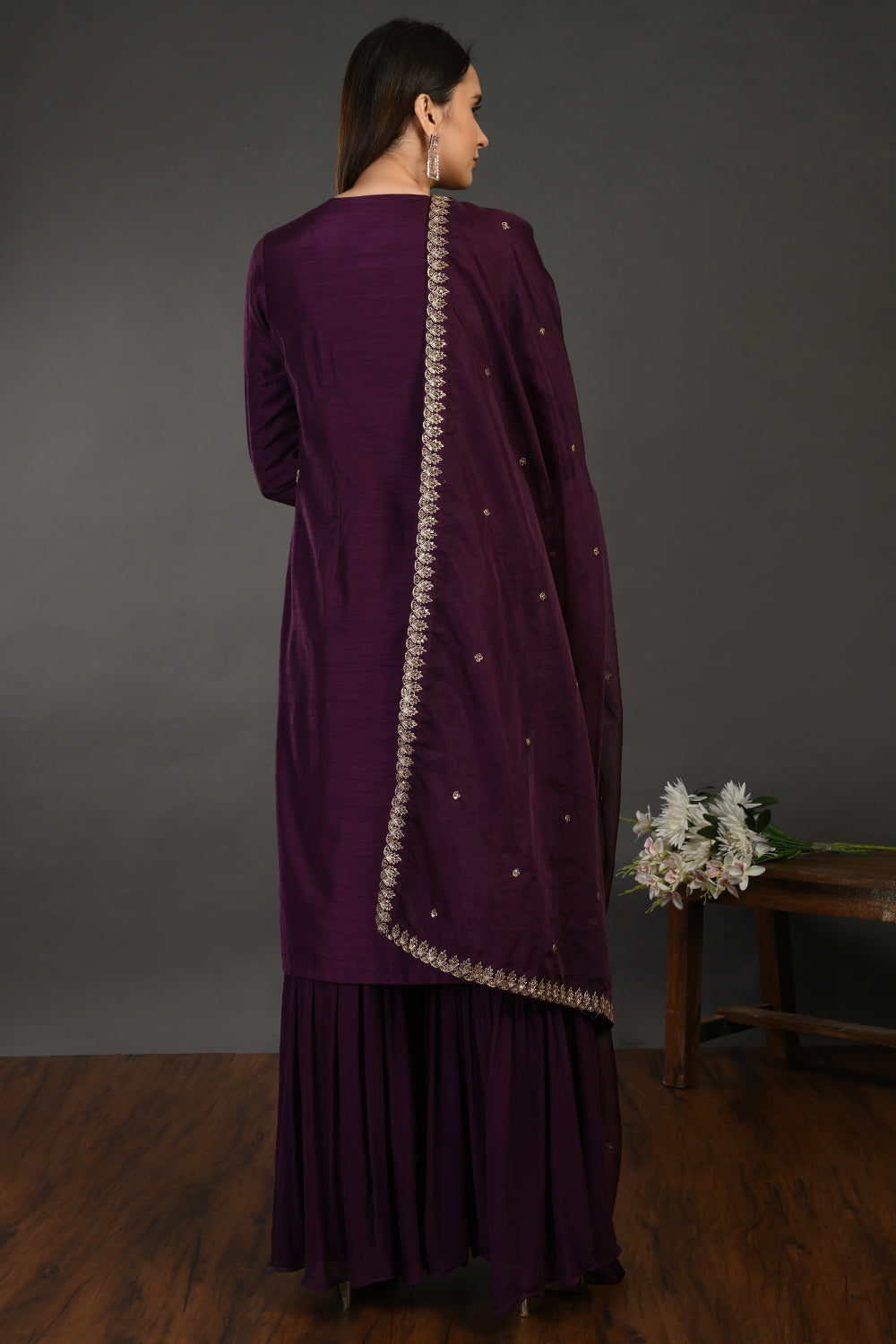Shop wine hue zari work georgette suit online in USA with dupatta. Dazzle on weddings and special occasions with exquisite Indian designer dresses, sharara suits, Anarkali suits, wedding lehengas from Pure Elegance Indian fashion store in USA.-back