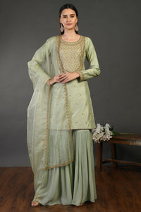 Buy sage green embroidered Mysore silk sharara suit online in USA with dupatta. Dazzle on weddings and special occasions with exquisite Indian designer dresses, sharara suits, Anarkali suits, wedding lehengas from Pure Elegance Indian fashion store in USA.-full view