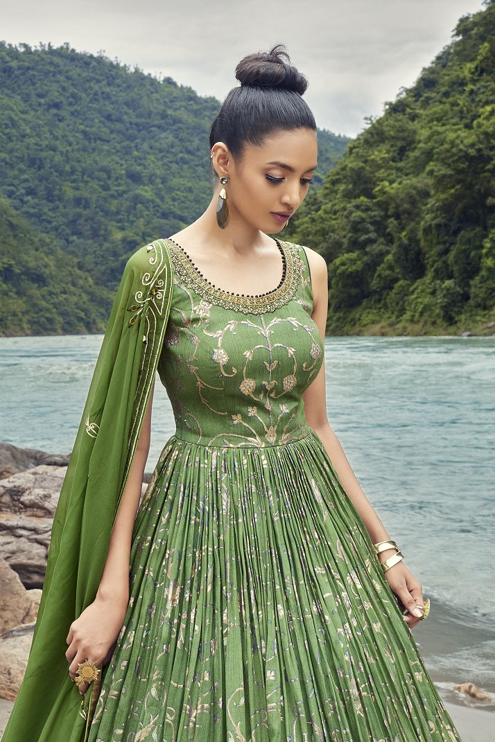 Buy a Beautiful green embroidered georgette anarkali suit with a dupatta. Shop online from Pure Elegance. Dazzle on weddings and special occasions with exquisite Indian designer dresses, sharara suits, Anarkali suits, and wedding lehengas from Pure Elegance Indian fashion store in the USA.