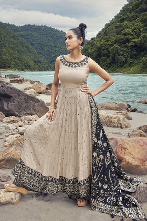 Buy a Beautiful light brown black-embroidered silk Anarkali suit with a black dupatta. Shop online from Pure Elegance. Dazzle on weddings and special occasions with exquisite Indian designer dresses, sharara suits, Anarkali suits, and wedding lehengas from Pure Elegance Indian fashion store in the USA.
