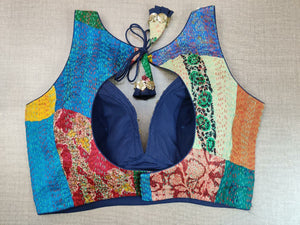 Buy beautiful multicolor patch work Kantha stitch embroidered blouse online in USA. Elevate your Indian ethnic saree looks with beautiful readymade saree blouse, embroidered saree blouses, Banarasi saree blouse, designer sari blouse from Pure Elegance Indian fashion store in USA.-back